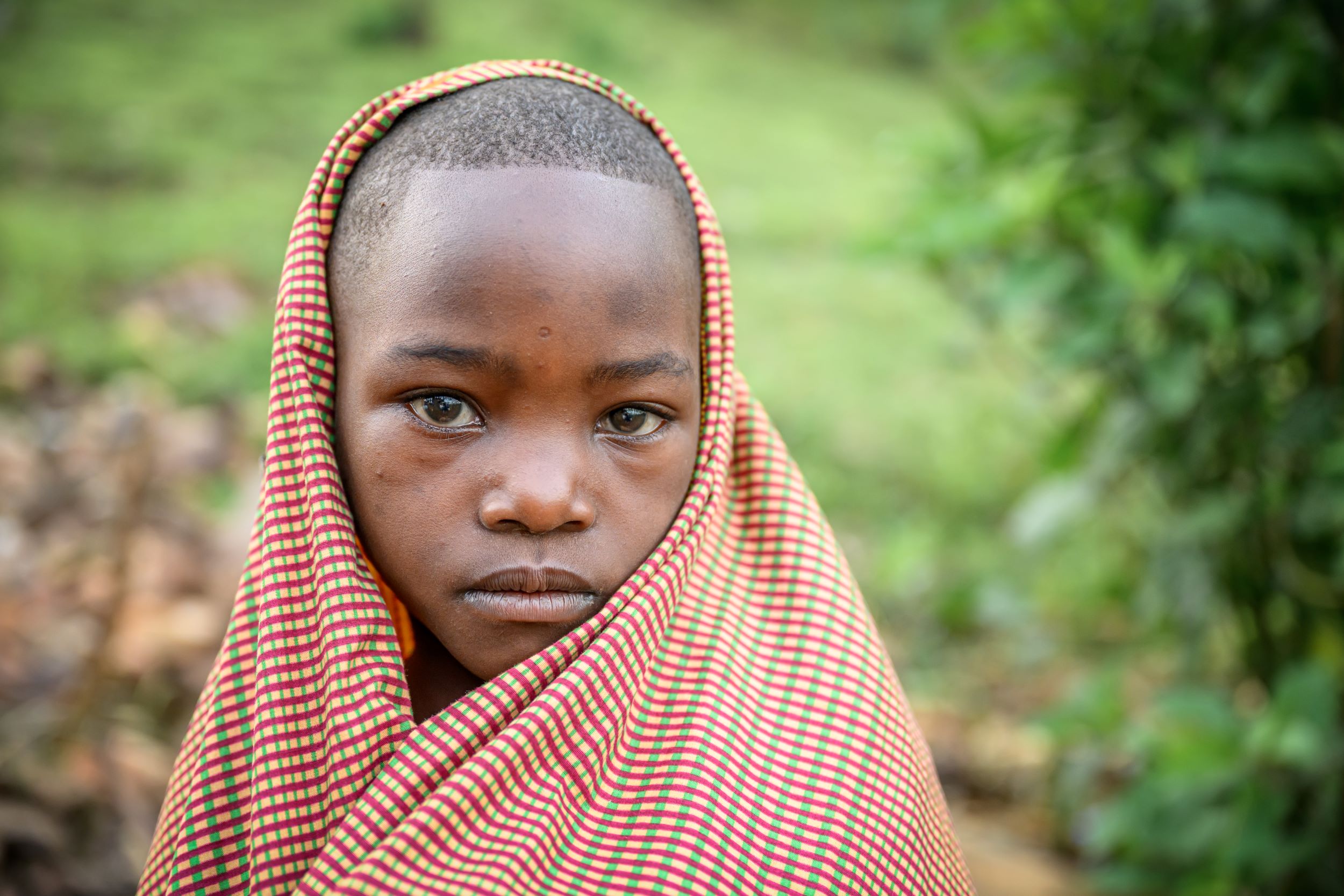 Rwandan girls wearing checked headscarf