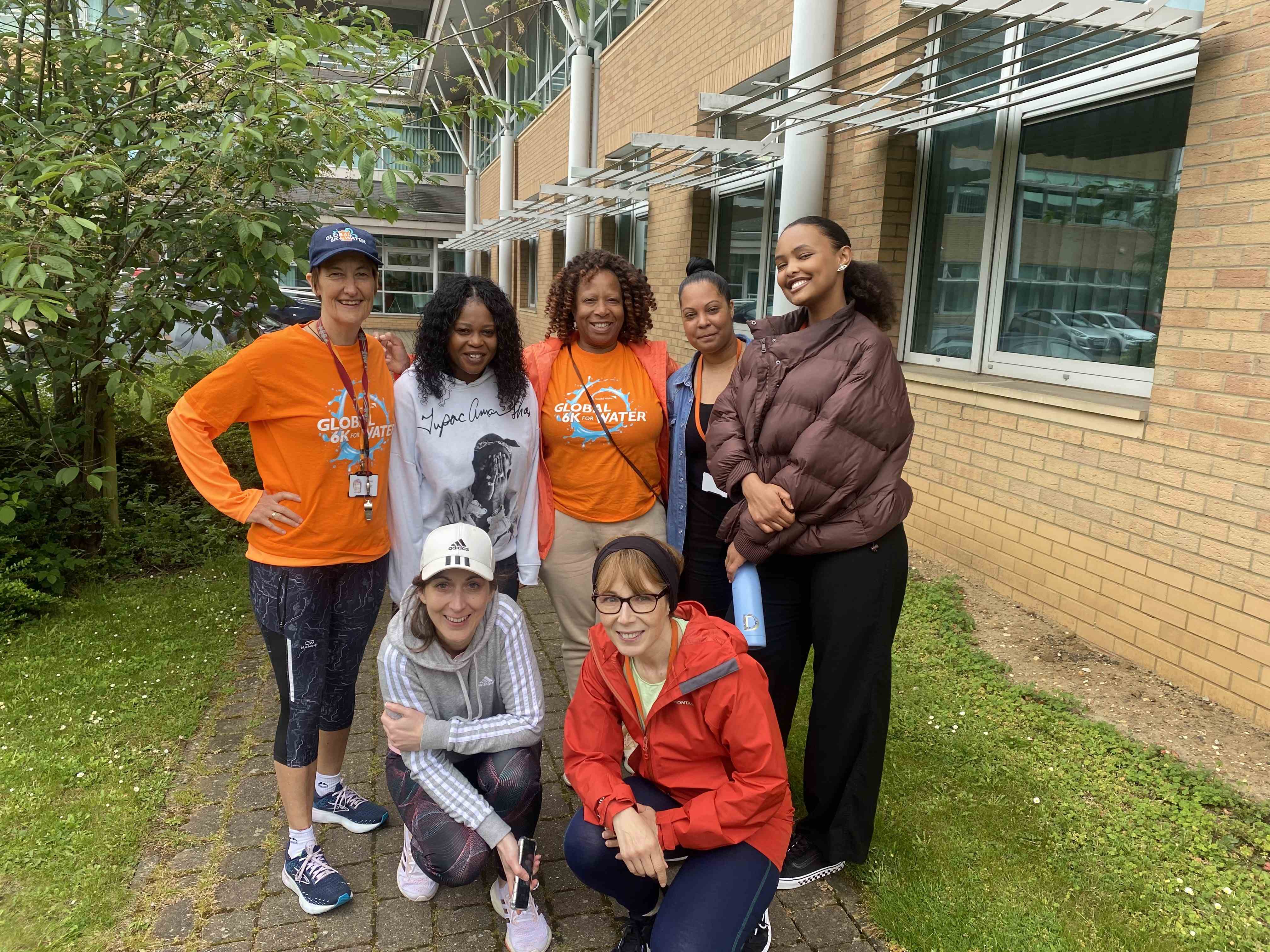 Staff wearing orange World Vision t-shirts