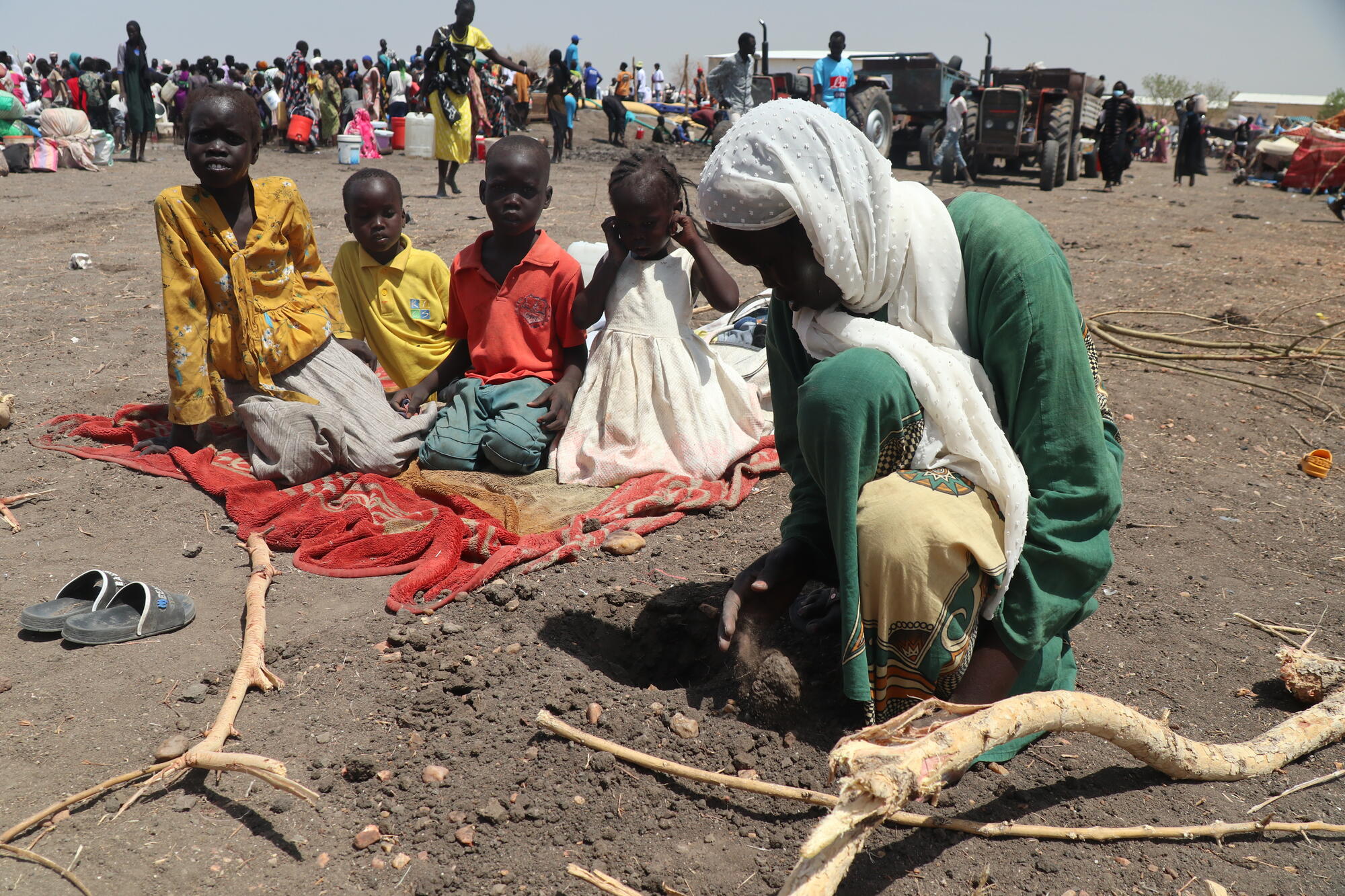 Ajang, a South Sudanese mother, and her children at a transit centre n Sudan