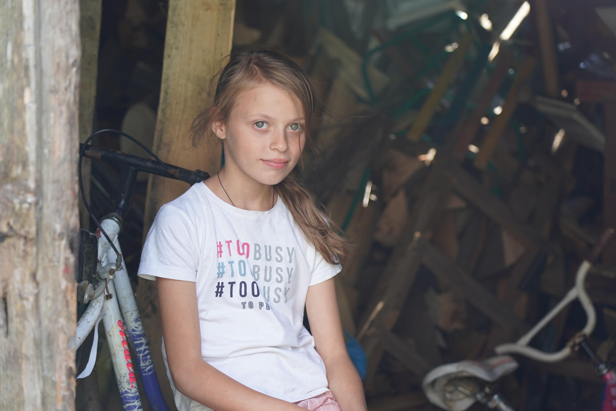 A Ukrainian girl sitting looking at the camera